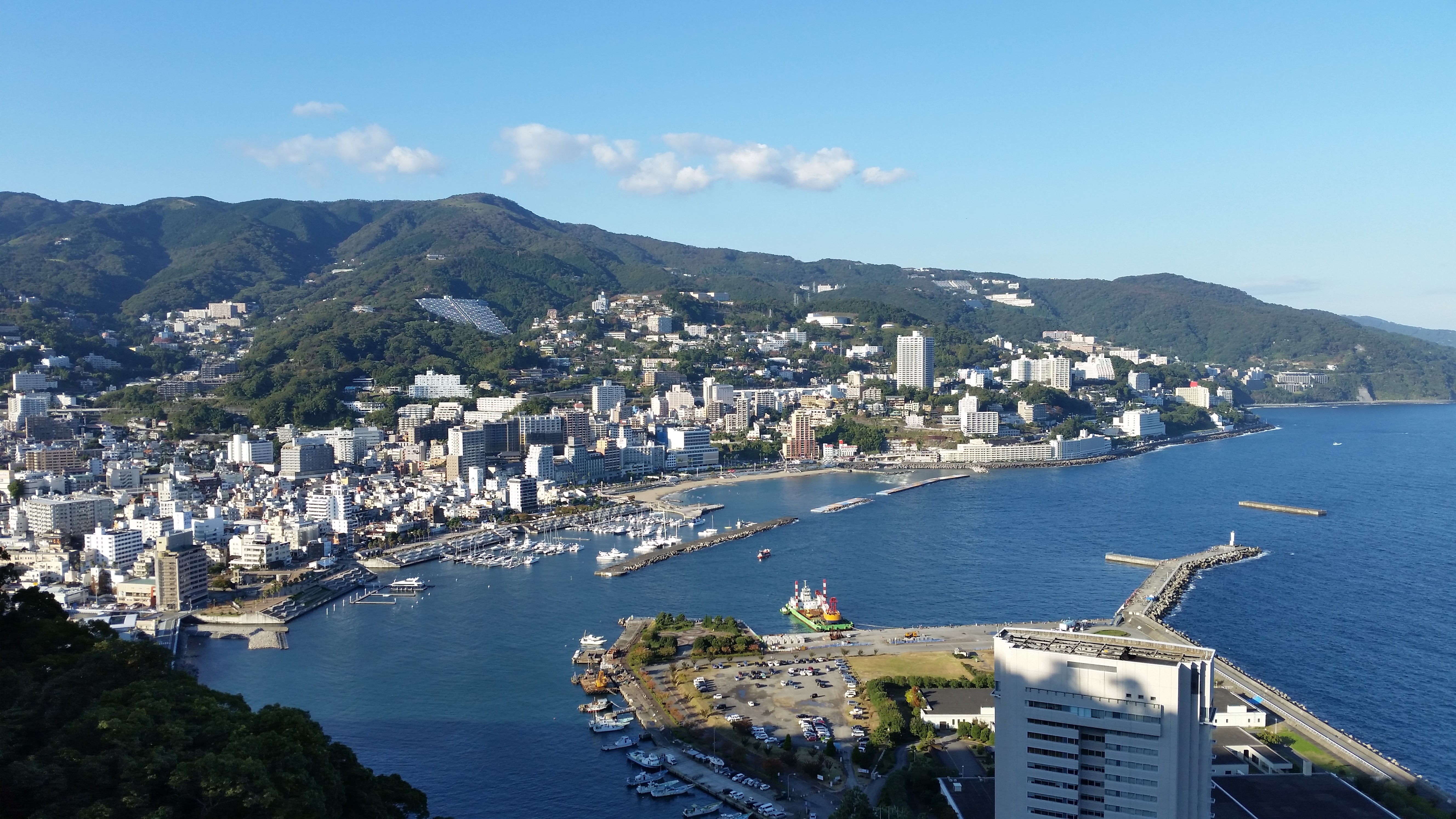Panoramic view of Atami city and its bay from the heights of the castle, with the harbour, marina and hillside hotels
