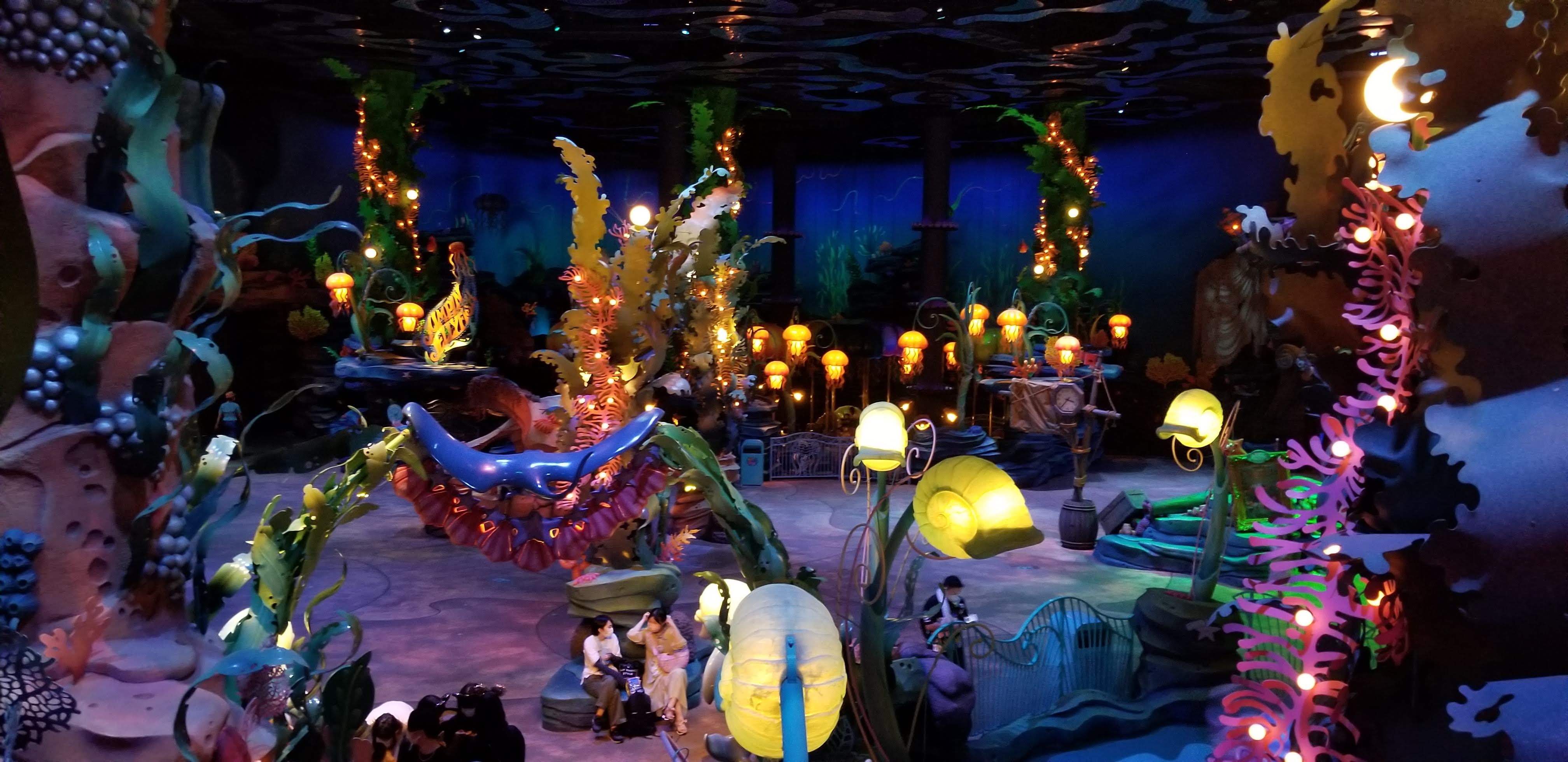 Mermaid Lagoon interior with underwater theming, Ariel figure, jellyfish lights and colourful coral decoration