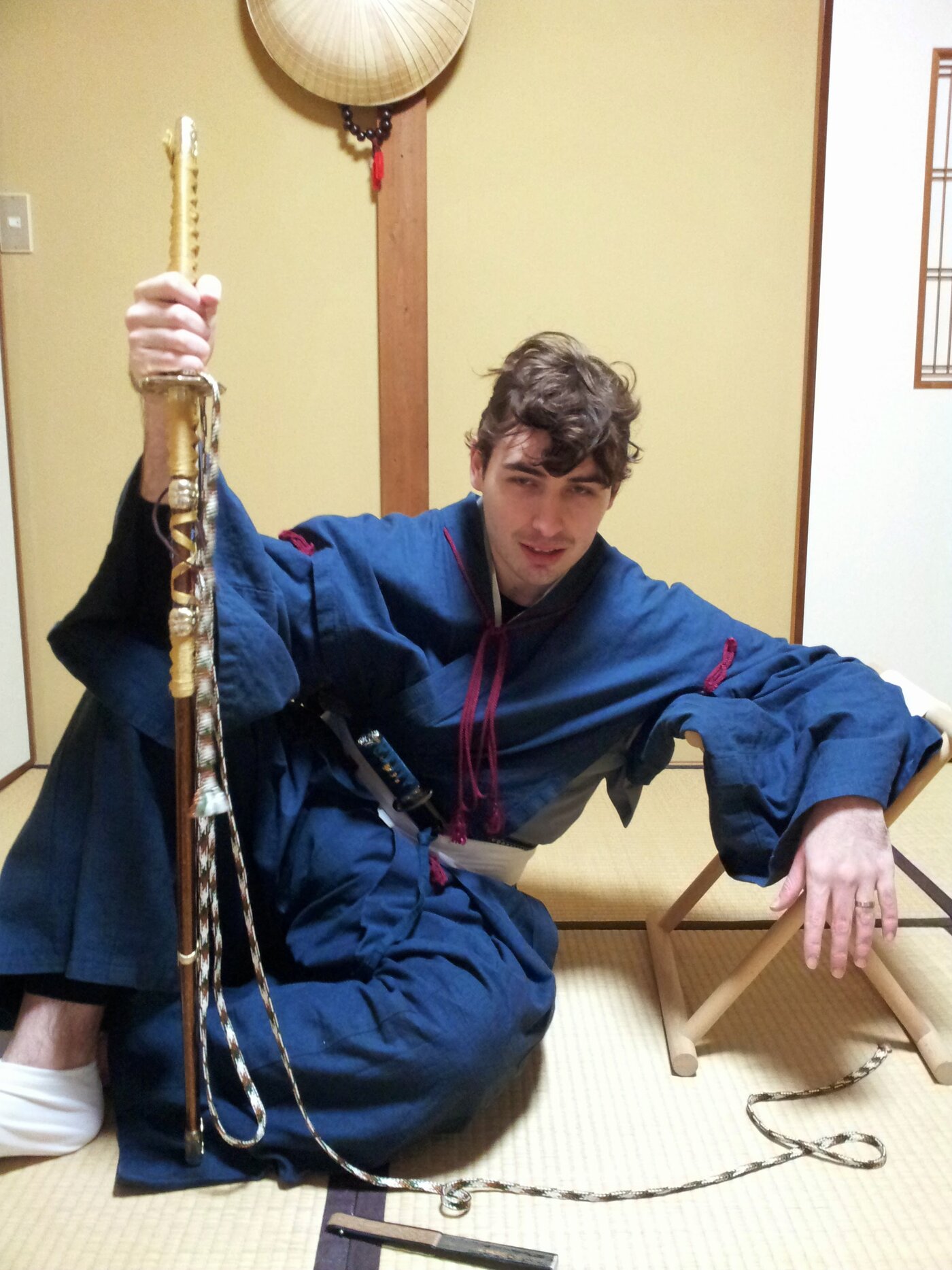 Diego in Kamakura period costume, with ceremonial sword and staff