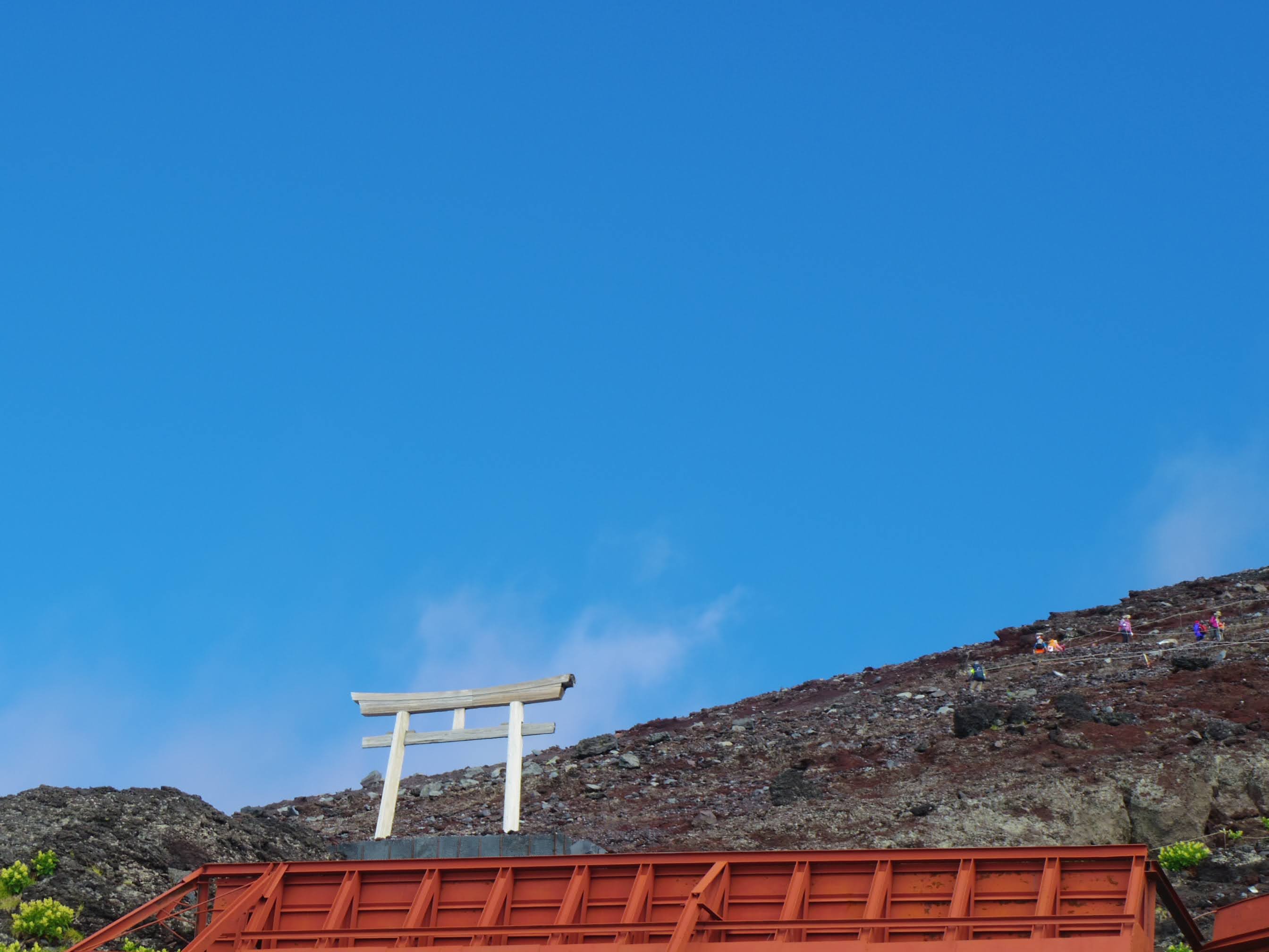A torii on the Fuji trail — the mountain is technically accessible, but the weather can change in minutes