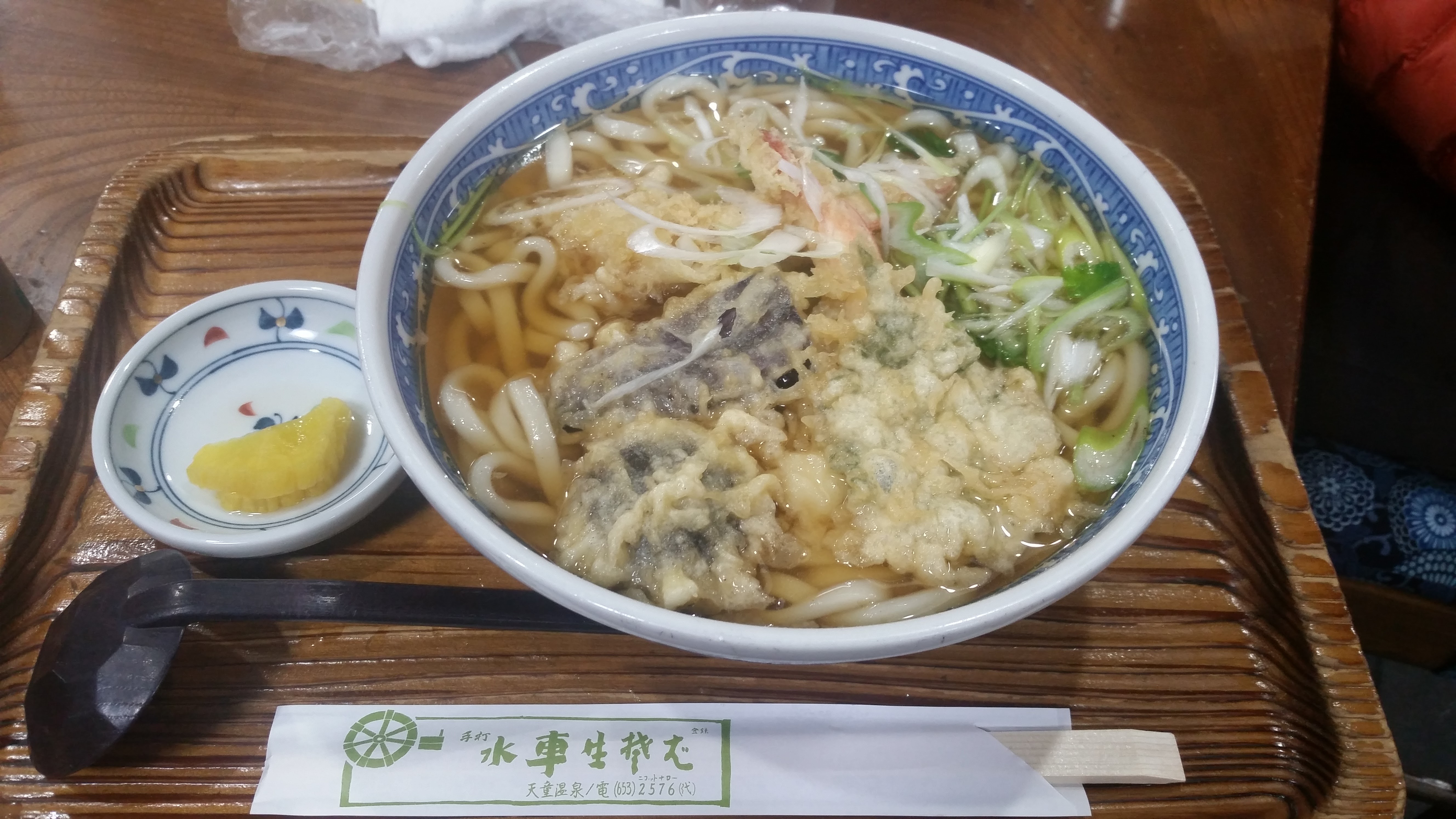Tempura udon in hot broth at a traditional Japanese noodle restaurant