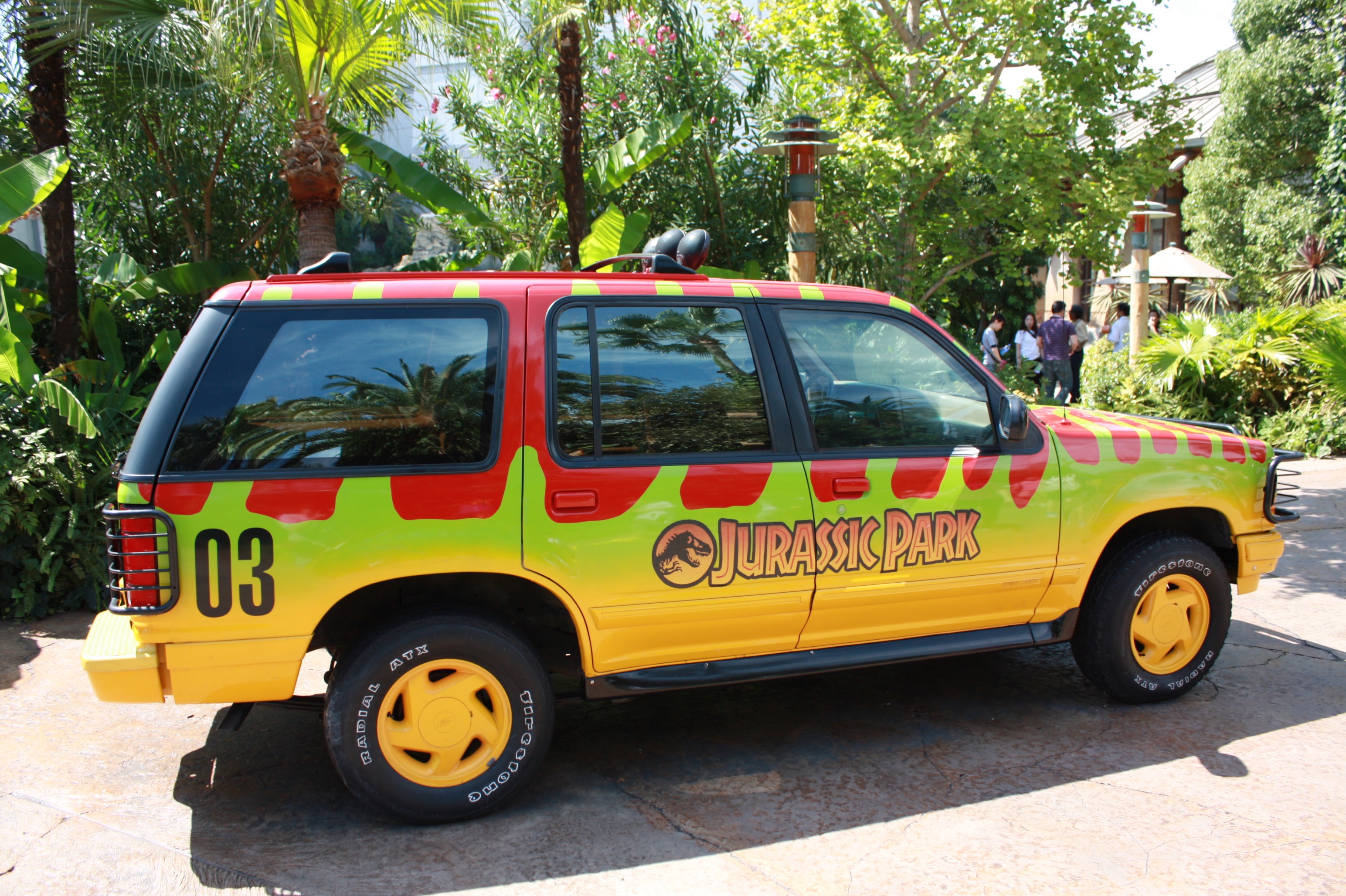 Iconic Jurassic Park jeep in the themed zone at Universal Studios Japan